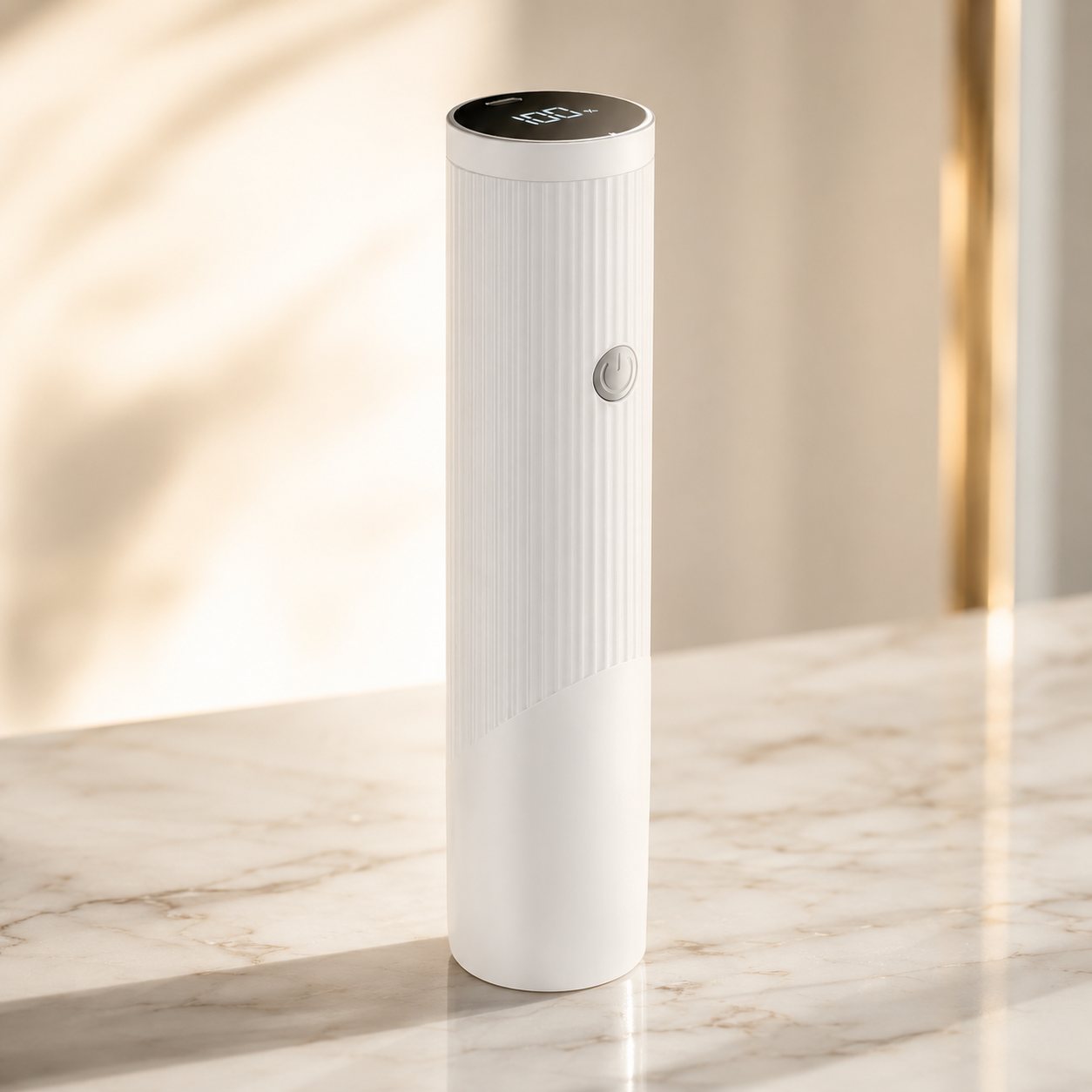 HELIOS handheld vacuum sealer standing on a marble counter in warm golden light
